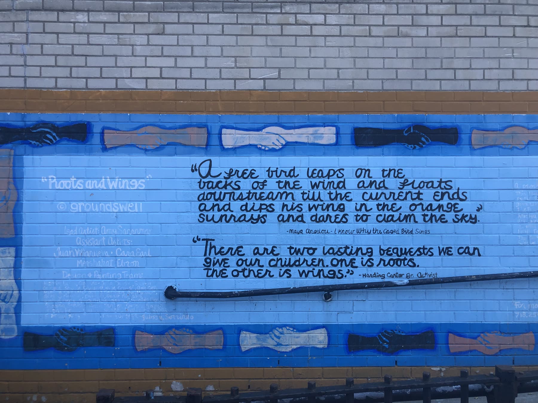 Mural with text about roots and wings in Gowanus, New York City